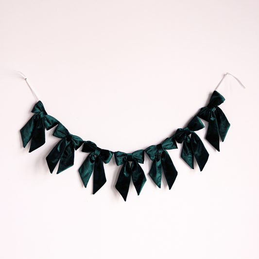 Emerald green velvet fabric bow garland with multiple bows, decorative and elegant for event decor by Luxe B Co