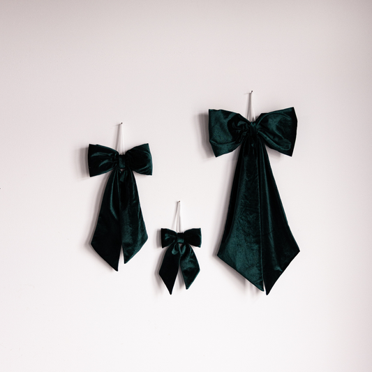 Emerald green velvet fabric bow by Luxe B Co, featuring soft, plush material and elegant design for accessories or decorations.
