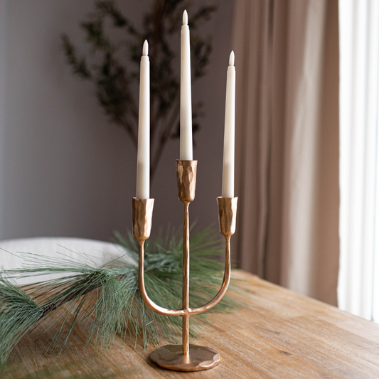 Small gold 3-arm iron candelabra candle holder by Luxe B Co with elegant, vintage-style design and detailed craftsmanship.