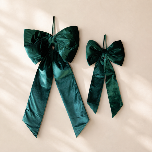 Large emerald green velvet bow by Luxe B Co featuring a soft, oversized design perfect for elegant hair or gift decoration.