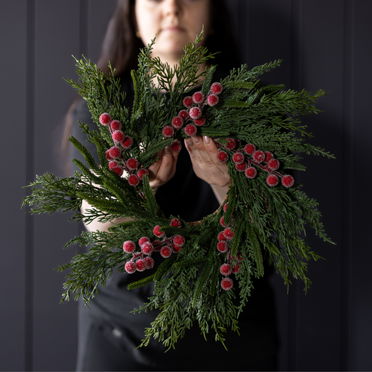 Red plum frosted berry Norfolk cypress real touch wreath, 14-inch Luxe B Co decorative wreath with vibrant red and green foliage.