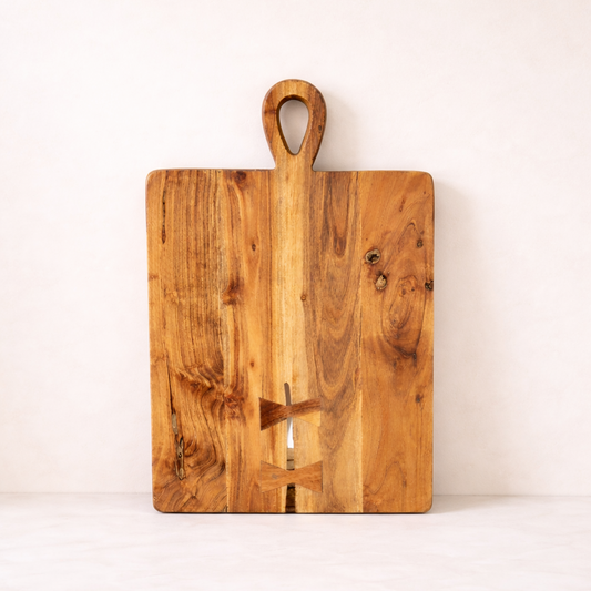 Wooden cutting board with handle on a white background