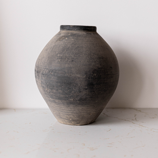 Vintage round grey vase by Luxe B Co, showcasing a classic ceramic design perfect for elegant home decor.