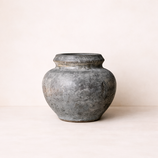Vintage-style gray ceramic pot on a white background