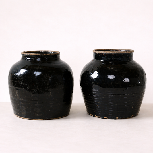 Vintage black glazed pot by Luxe B Co, showcasing a classic ceramic container with a smooth, glossy black finish.