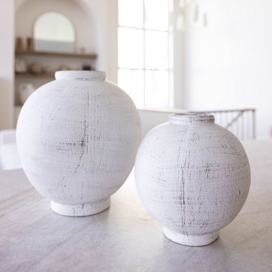 White terracotta Chios vase pot with round shape by Luxe B Co, featuring a smooth, matte finish for elegant home decor.