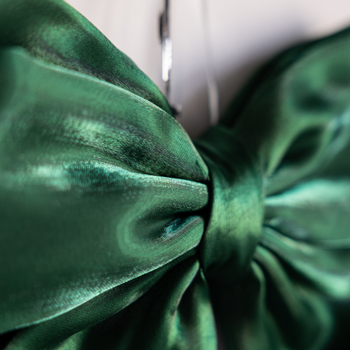 Emerald green gauze bow by Luxe B Co, featuring a bold, soft fabric bow with a stylish, eye-catching design.
