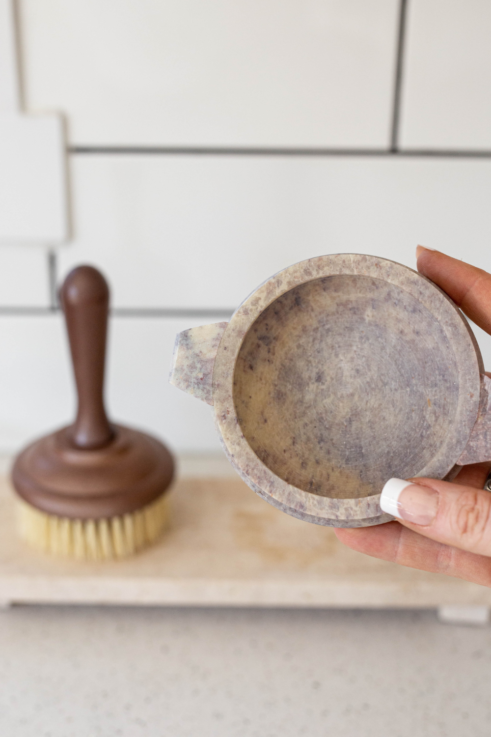 Luxe B Co soapstone soap dish with marble finish, rectangular shape, smooth surface, and decorative design for bathroom use.