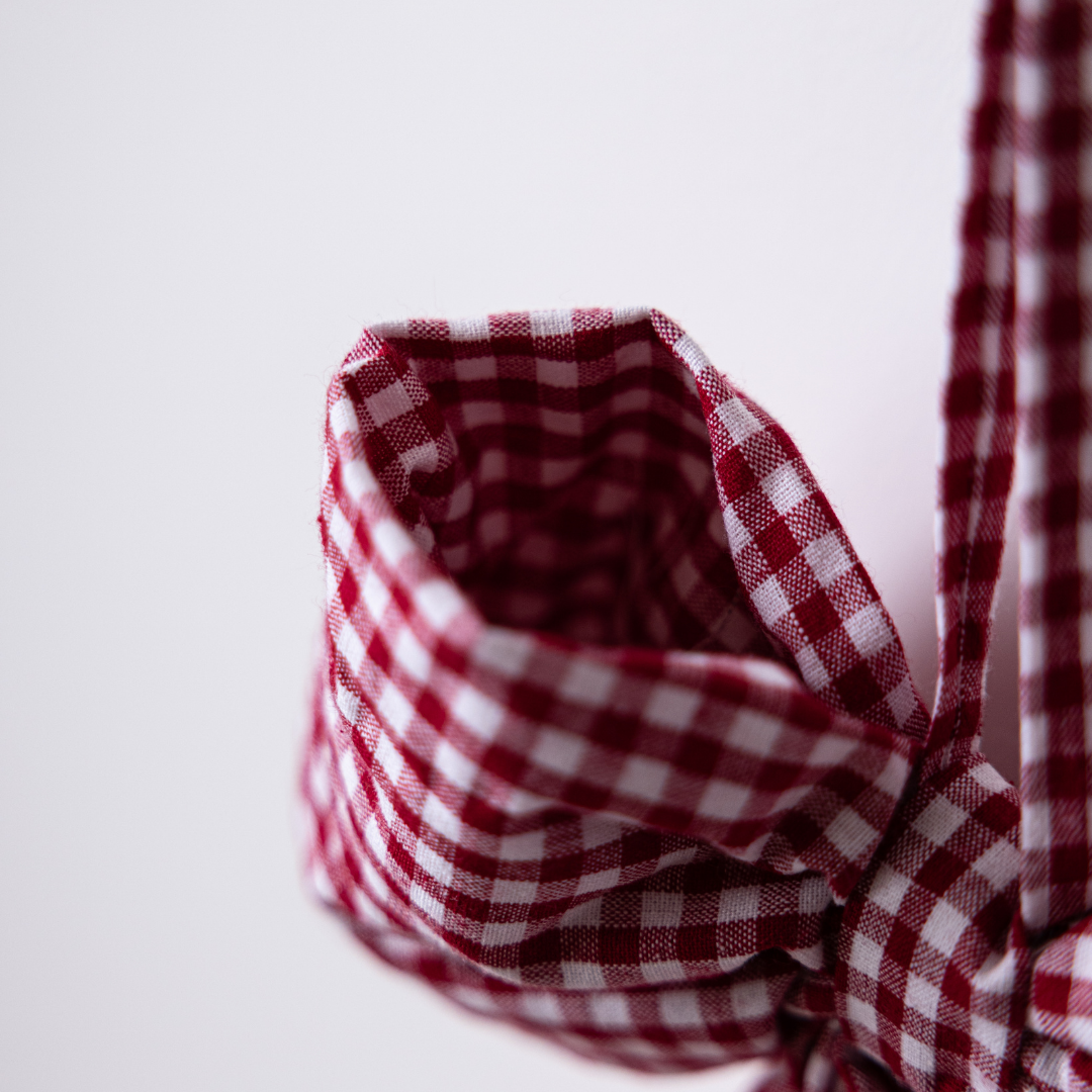 Red gingham fabric bows by Luxe B Co, featuring classic checkered pattern and soft fabric for charming accessory accents.