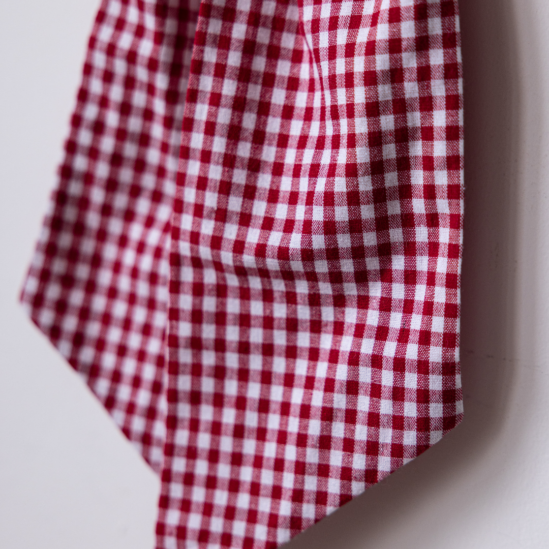 Red gingham fabric bows by Luxe B Co, showing tied ribbon bows with classic checkered pattern and stylish design.