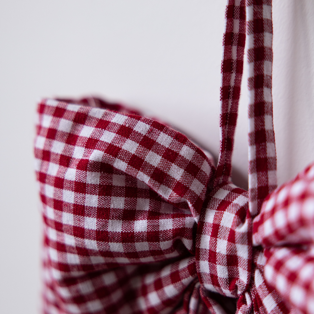 Red gingham fabric bows by Luxe B Co, featuring classic pattern and soft material, perfect for hair accessories or gift embellishments.