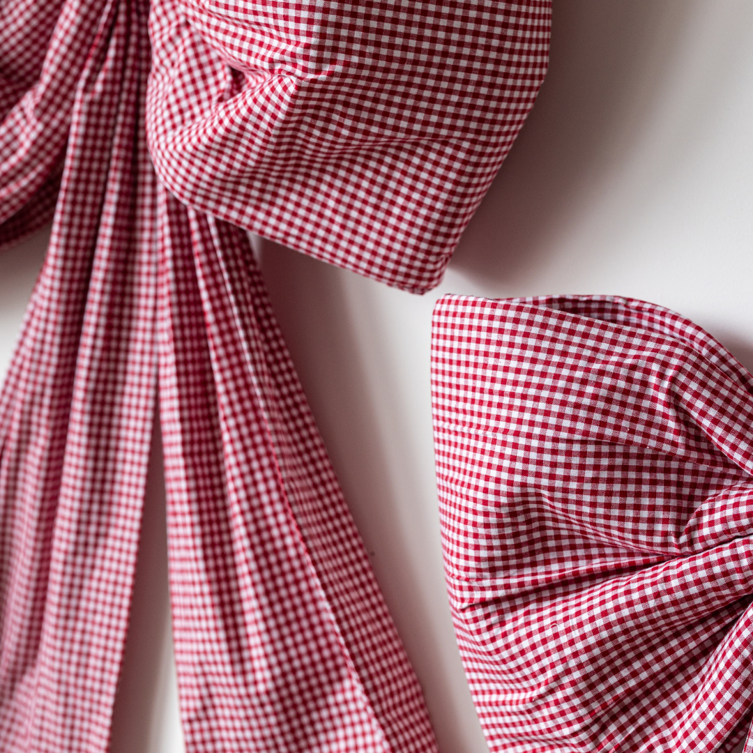 Luxe B Co oversized red gingham bow, large fabric bow with a classic gingham pattern, perfect for accessories or gift wrapping.
