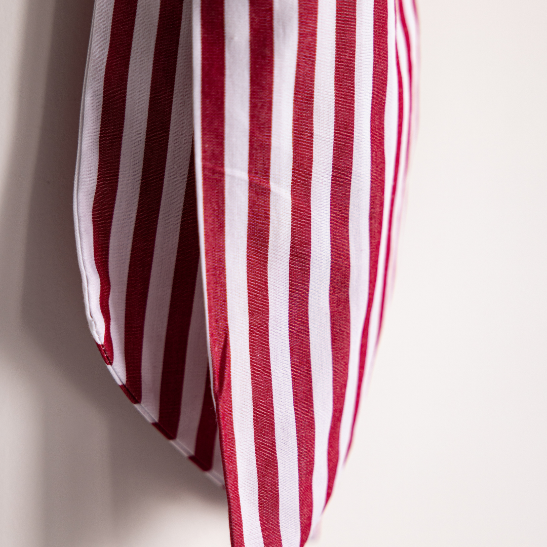 Red fabric candy cane bows from Luxe B Co featuring festive holiday-themed bow designs for Christmas decorations.