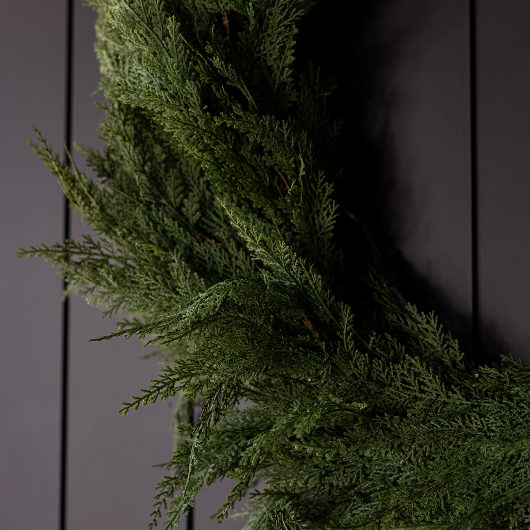 Luxe B Co Cypress Leaf Full Real Touch Wreath, 24-inch decorative wreath with realistic green cypress leaves on a neutral background.