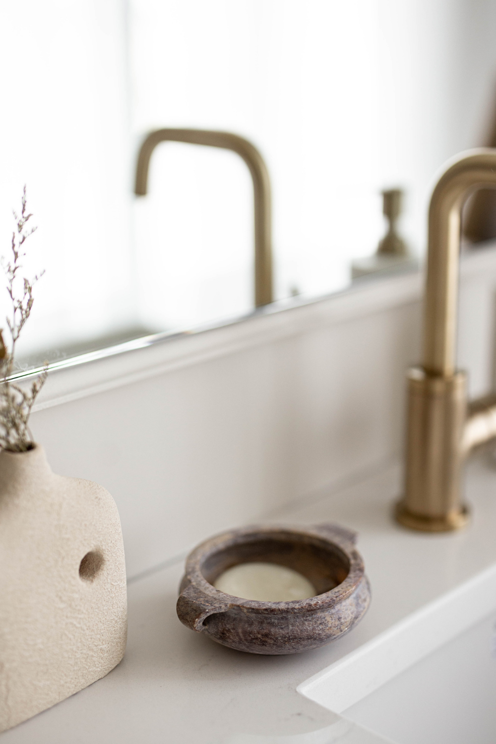 Marble soap dish from Luxe B Co, made of soapstone, with smooth surface and elegant design for holding soap.