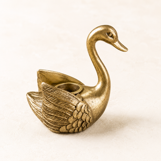 Antique-inspired swan-shaped tapered candle holder by Luxe B Co, featuring elegant design and detailed craftsmanship.
