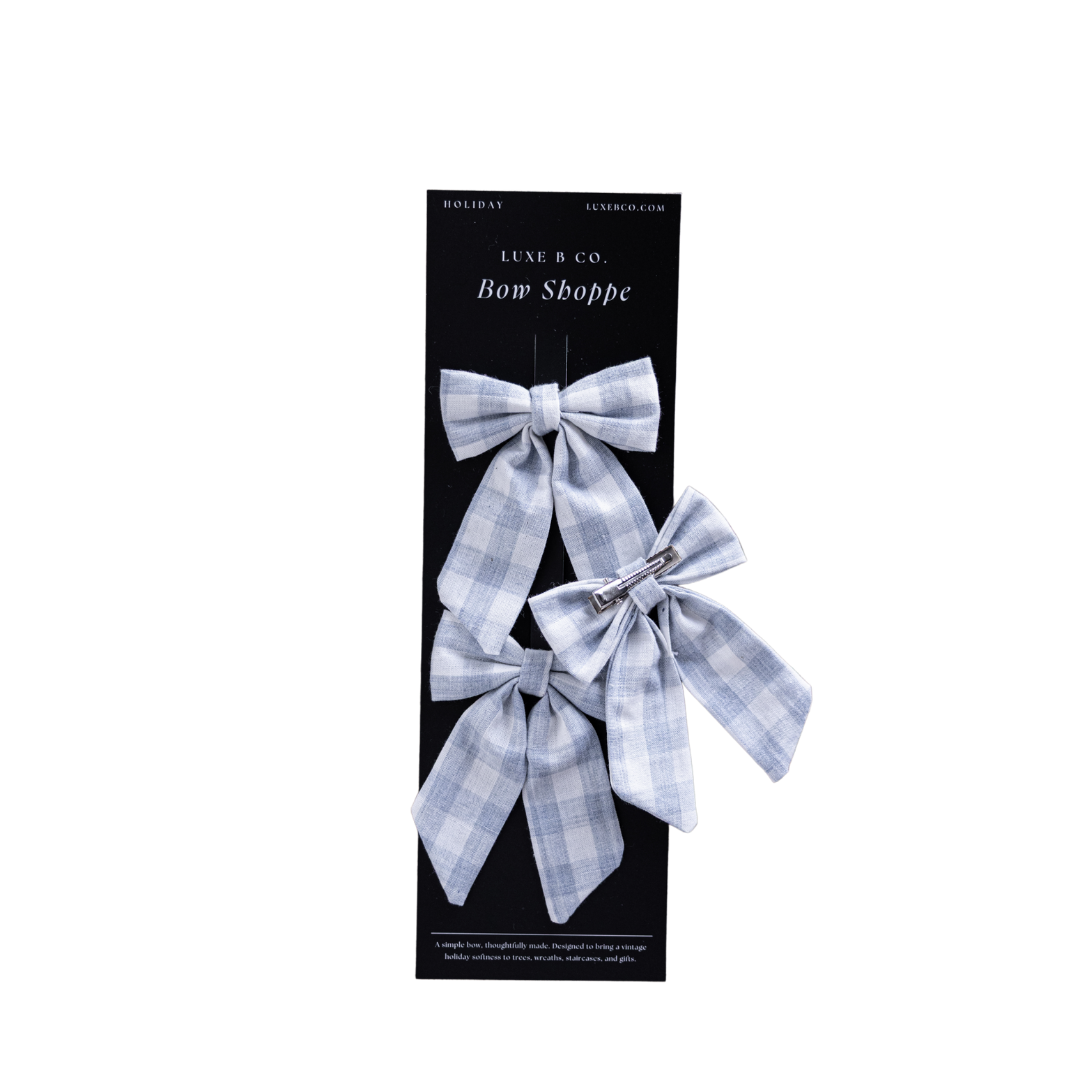 Baby blue gingham fabric mini bows with clips set by Luxe B Co, perfect for babies and toddlers' hair accessories.