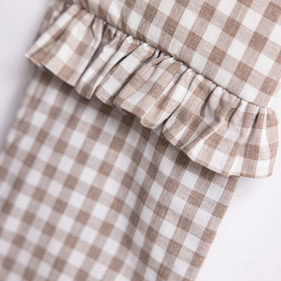 Beige gingham holiday stocking by Luxe B Co with festive design, perfect for Christmas decor and holiday cheer.