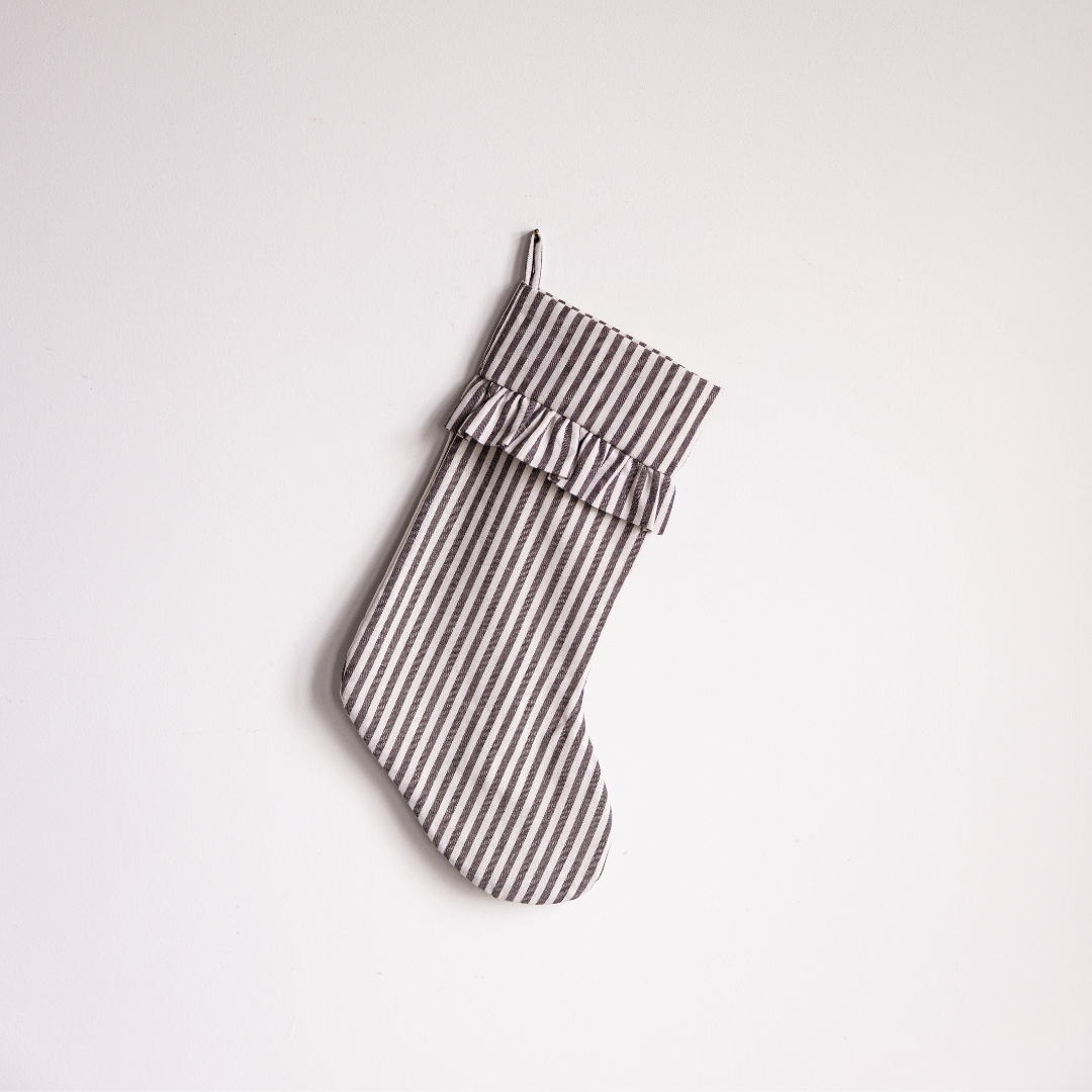 Brown striped holiday stocking by Luxe B Co featuring festive design and plush material for seasonal decor.