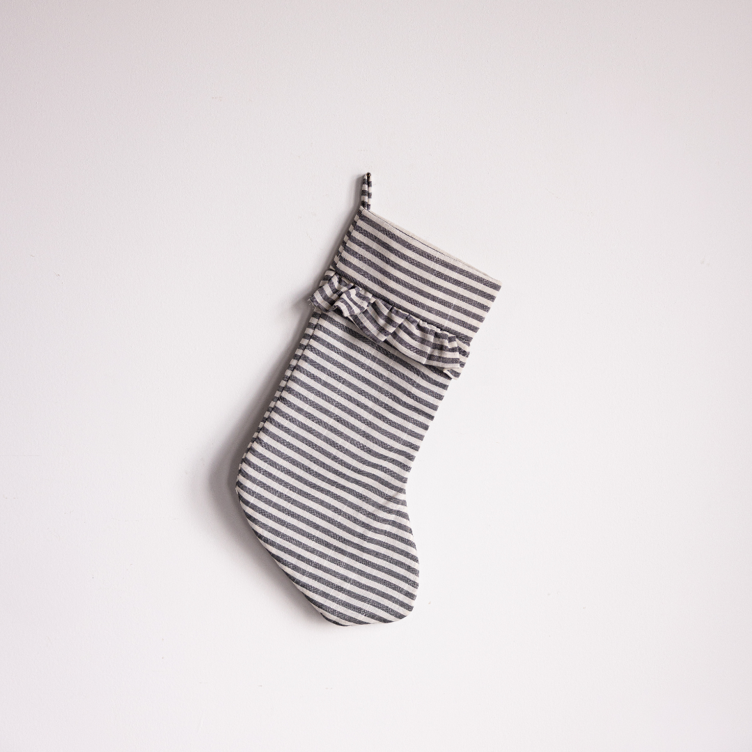 Charcoal striped holiday stocking by Luxe B Co, featuring a cozy fabric and festive design for Christmas decorations.