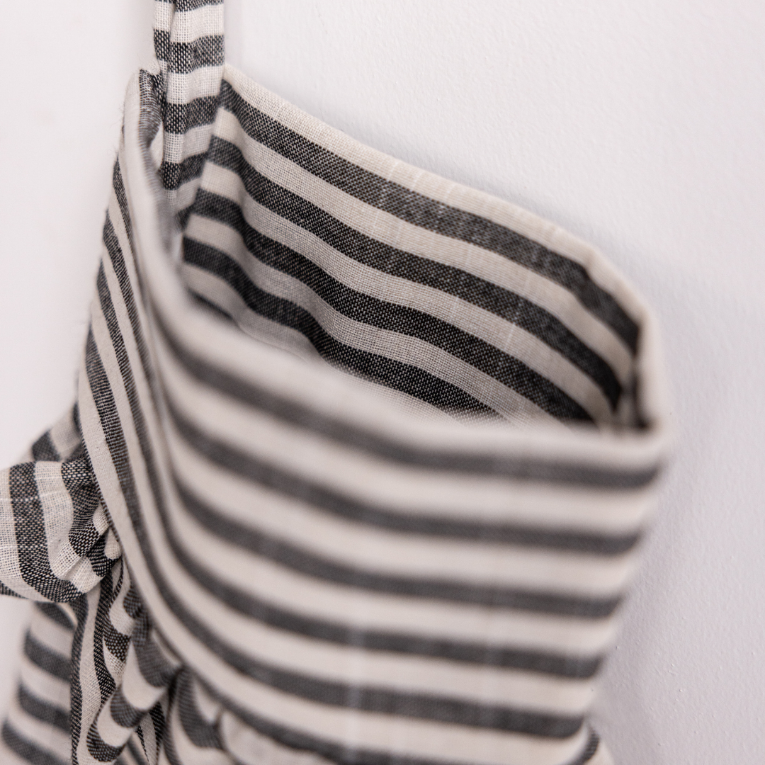 Charcoal striped holiday stocking by Luxe B Co, featuring a cozy knit design with festive stripes for Christmas decor.