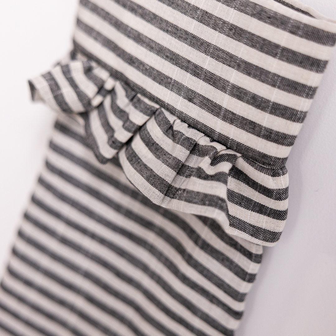 Charcoal striped holiday stocking by Luxe B Co featuring festive woven pattern and soft fabric for seasonal decor.