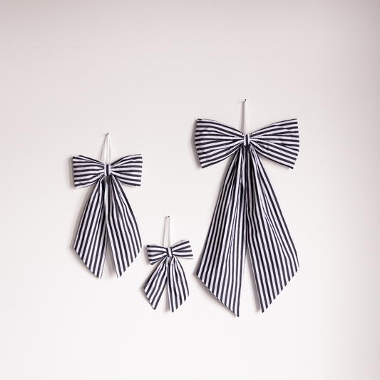 Charcoal striped fabric bows by Luxe B Co, elegant accessory with classic design, perfect for styling or gift wrapping.