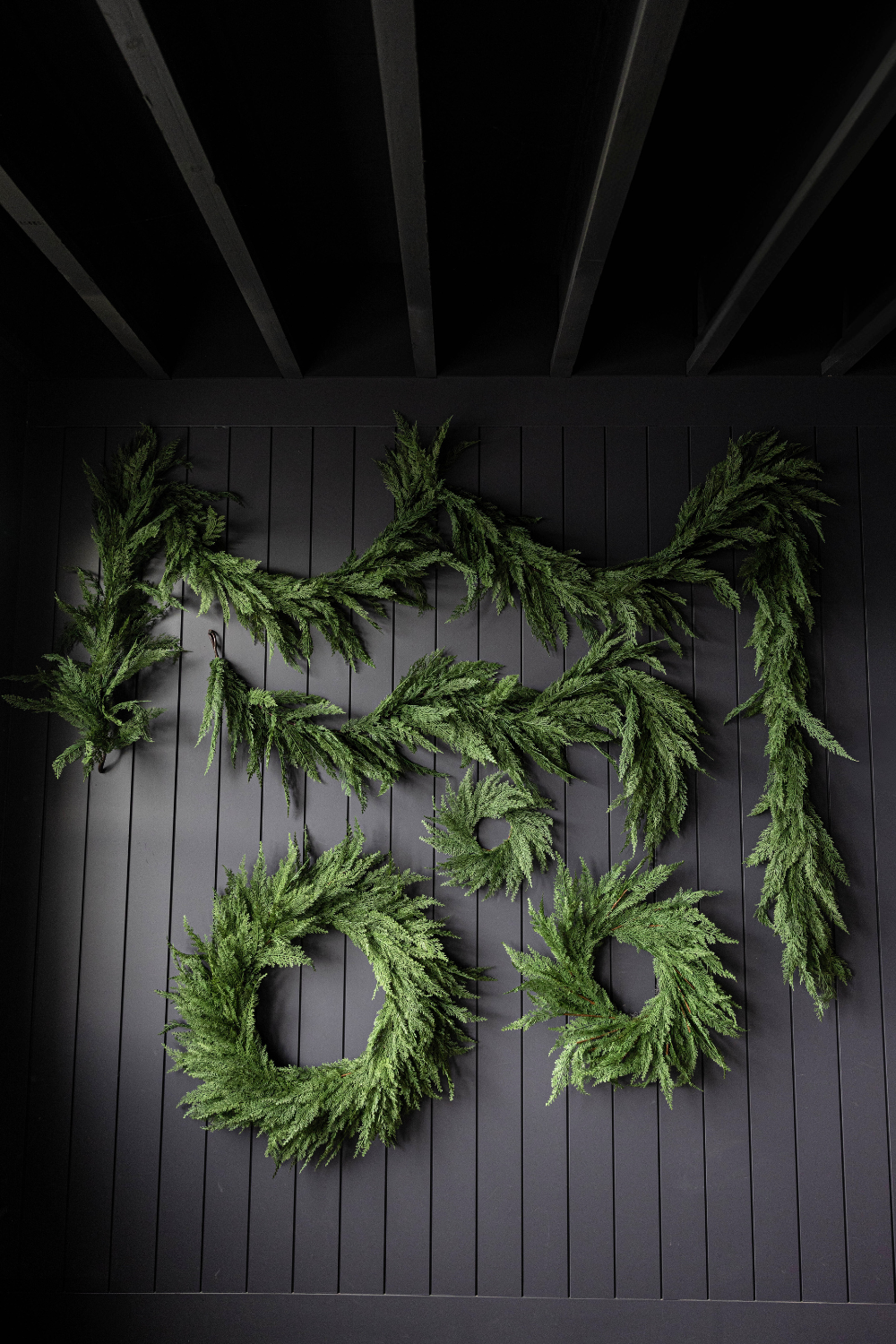 Realistic 15 ft Cypress leaf full garland for Christmas by Luxe B Co, featuring lush, full greenery perfect for holiday decorating.