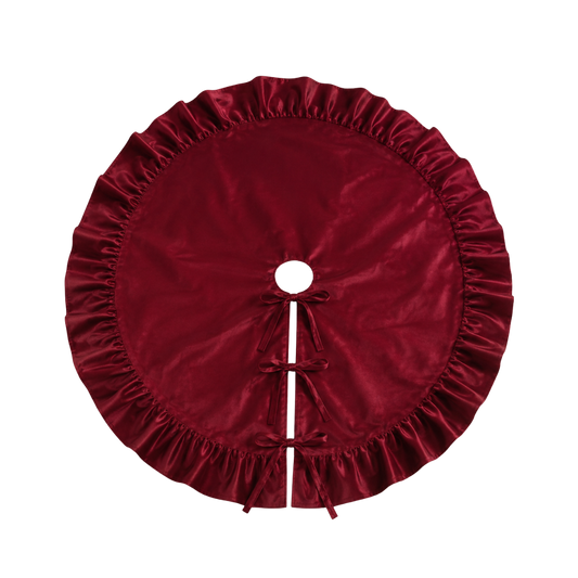 Deep red velvet tree skirt with ruffle trim from Luxe B Co., featuring a luxurious fabric and decorative ruffles for holiday decor.