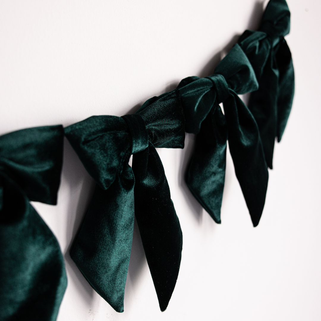 Emerald green velvet fabric bow garland with multiple large bows, perfect for decoration, by Luxe B Co.