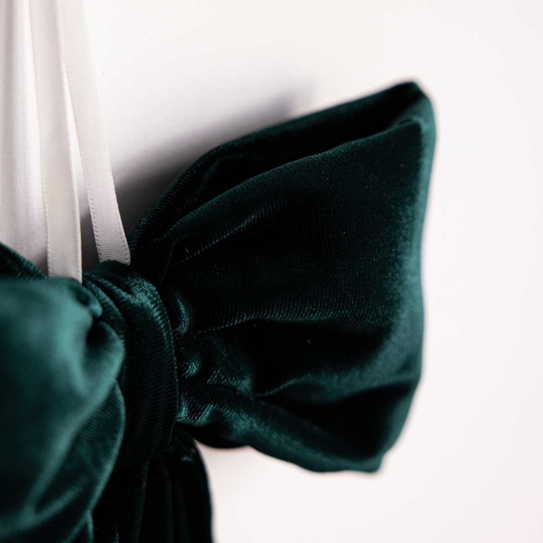 Emerald green velvet fabric bows by Luxe B Co, featuring soft plush texture and elegant design for accessories or decorations.