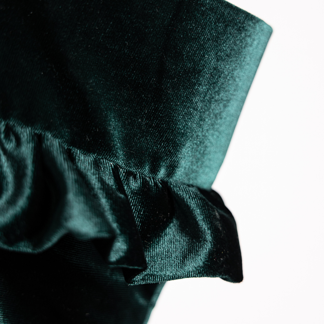 Emerald velvet holiday stocking by Luxe B Co with plush fabric and festive design, perfect for Christmas decoration.