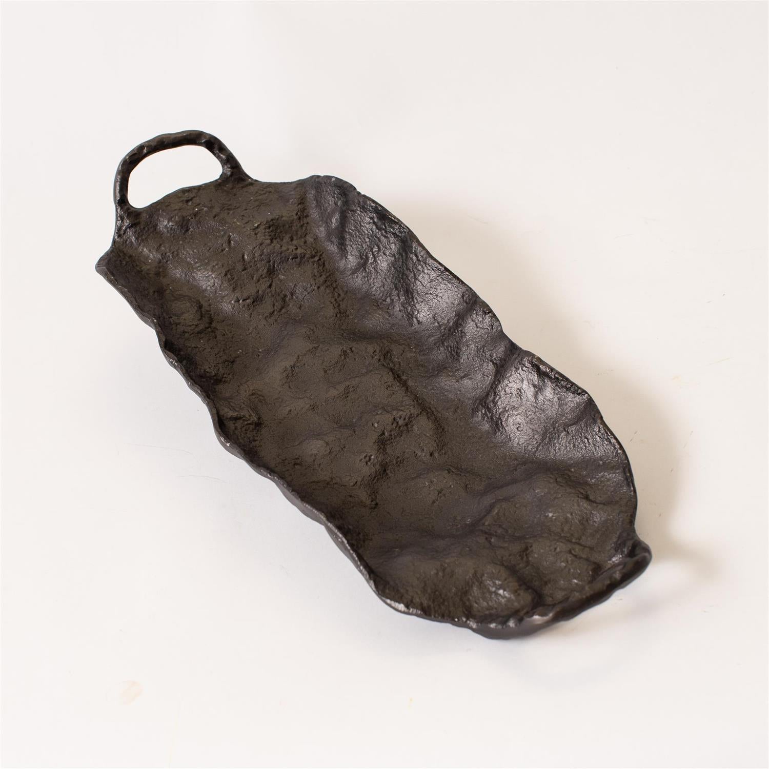 Decorative forged aluminum tray by Luxe B Co. with intricate design, perfect for stylish home decor displays.