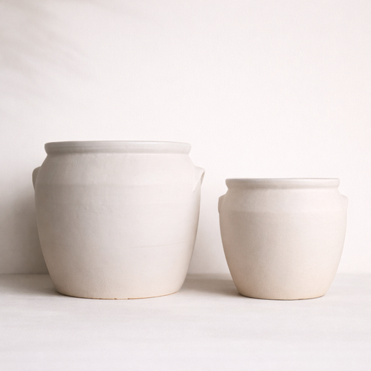 Two ceramic pots on a white background