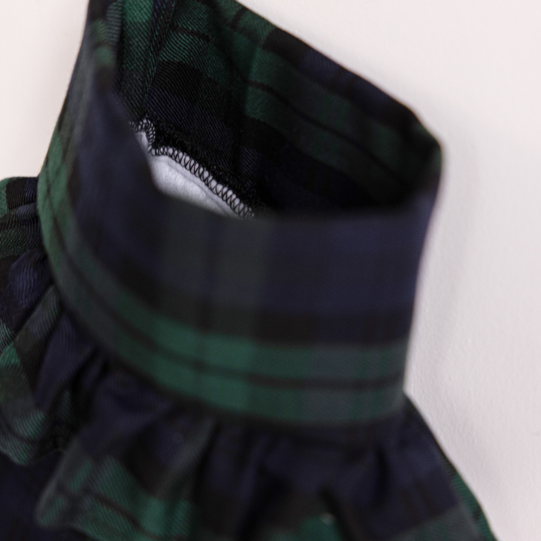 Green plaid holiday stocking by Luxe B Co featuring festive pattern, soft fabric, and hanging loop for Christmas decoration.
