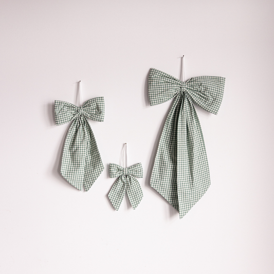Green small gingham fabric bows by Luxe B Co, soft and stylish accessories for hair or clothing.