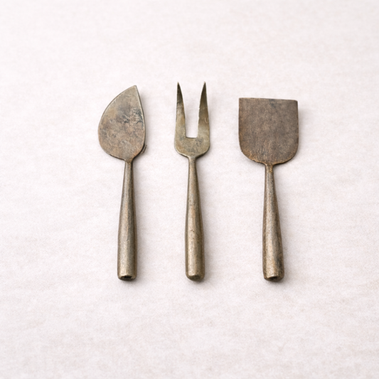 Set of three hand-forged metal cheese servers by Creative Co-op, featuring elegant serveware for cheese presentation.