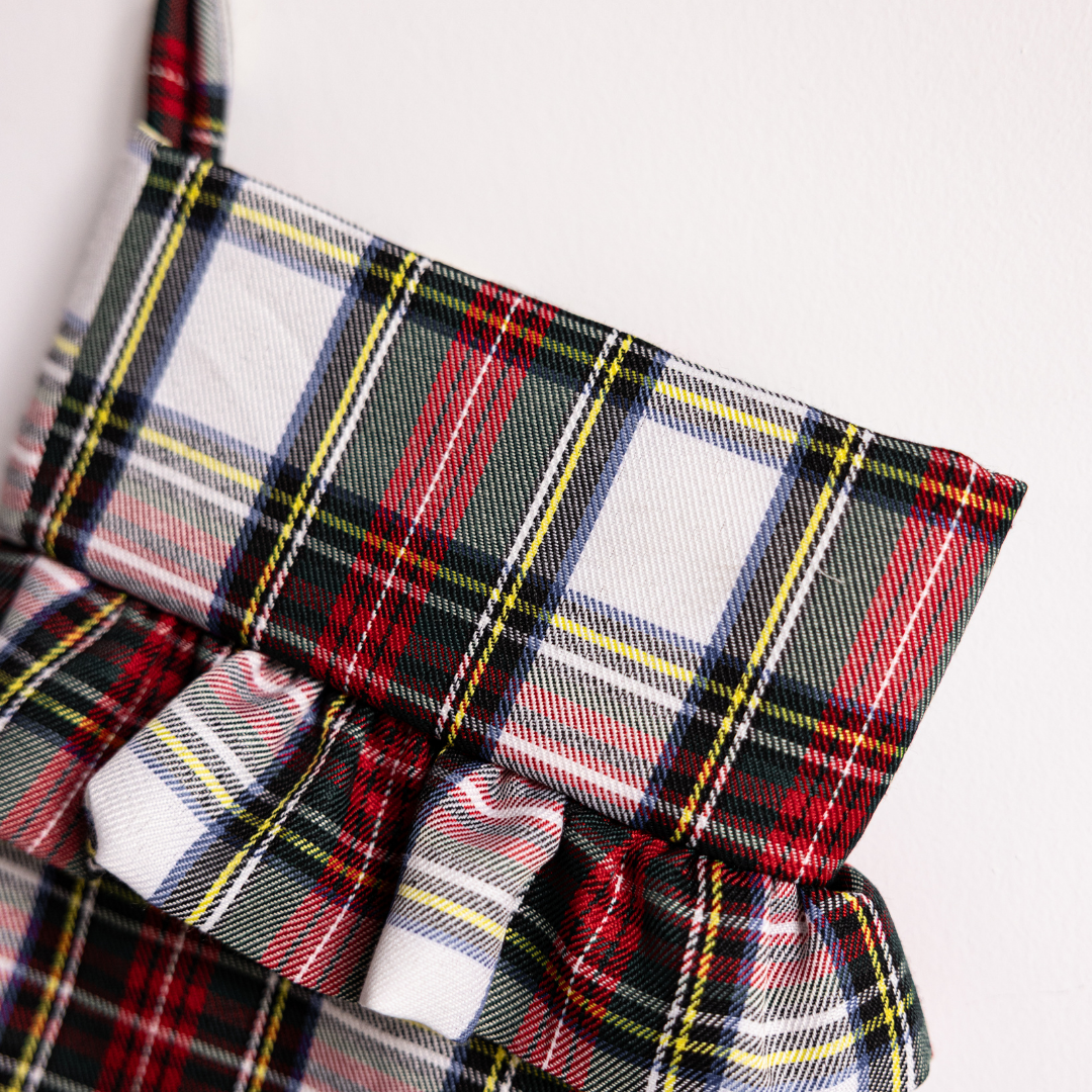 Luxe B Co holiday plaid stocking with red and green tartan pattern, perfect for Christmas decorations and festive cheer.