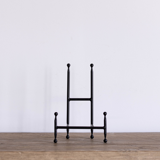 Iron cookbook stand by Luxe B Co featuring a sturdy iron frame, perfect for holding cookbooks and recipes in the kitchen.
