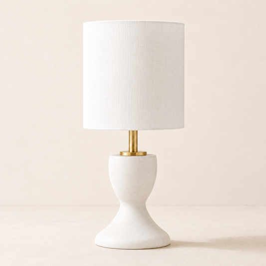 Luxe B Co Lisa Mini Lamp featuring a sleek, modern design with a soft glowing light on a neutral surface.