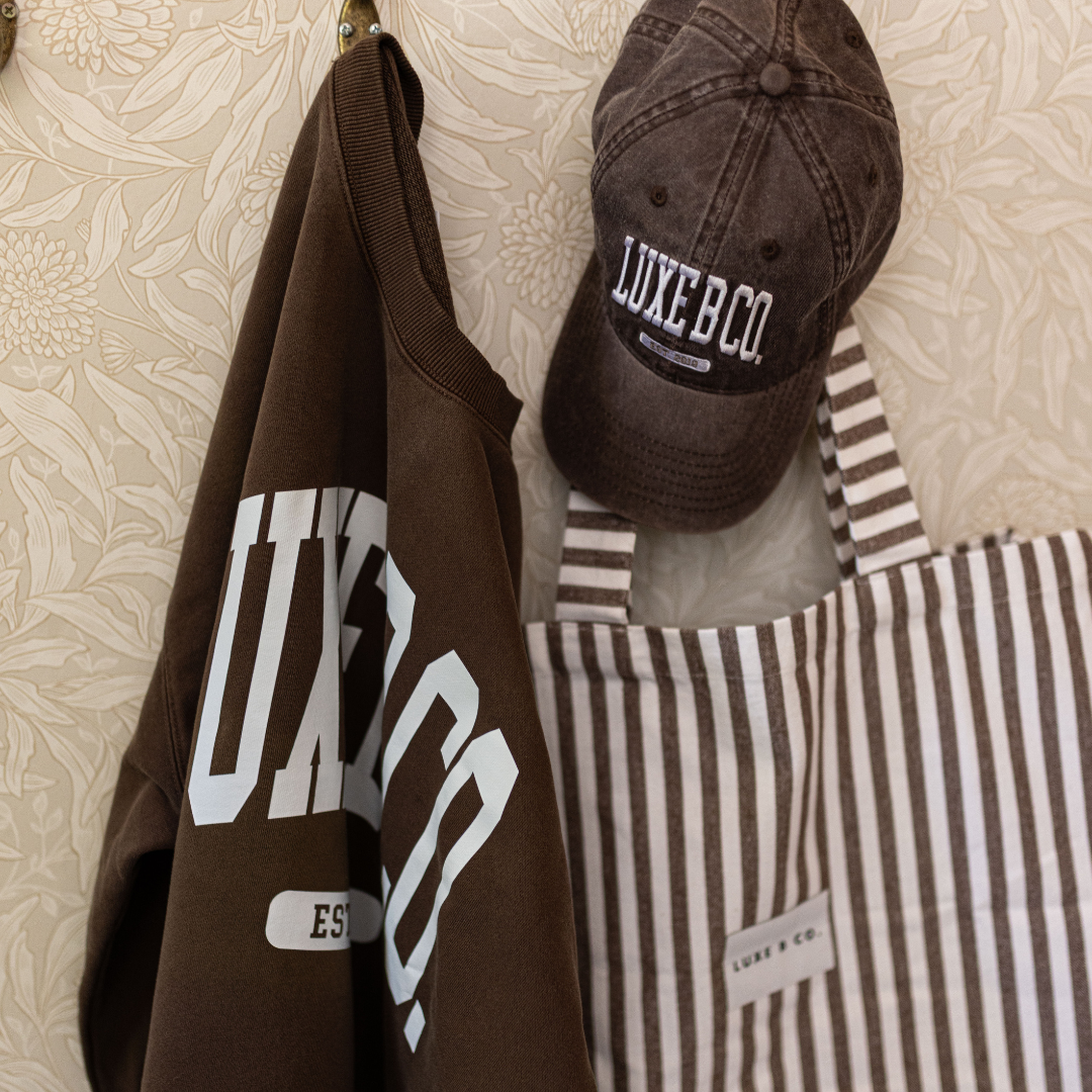 Luxe B Co. brown baseball cap with curved brim and adjustable strap, stylish casual hat for everyday wear