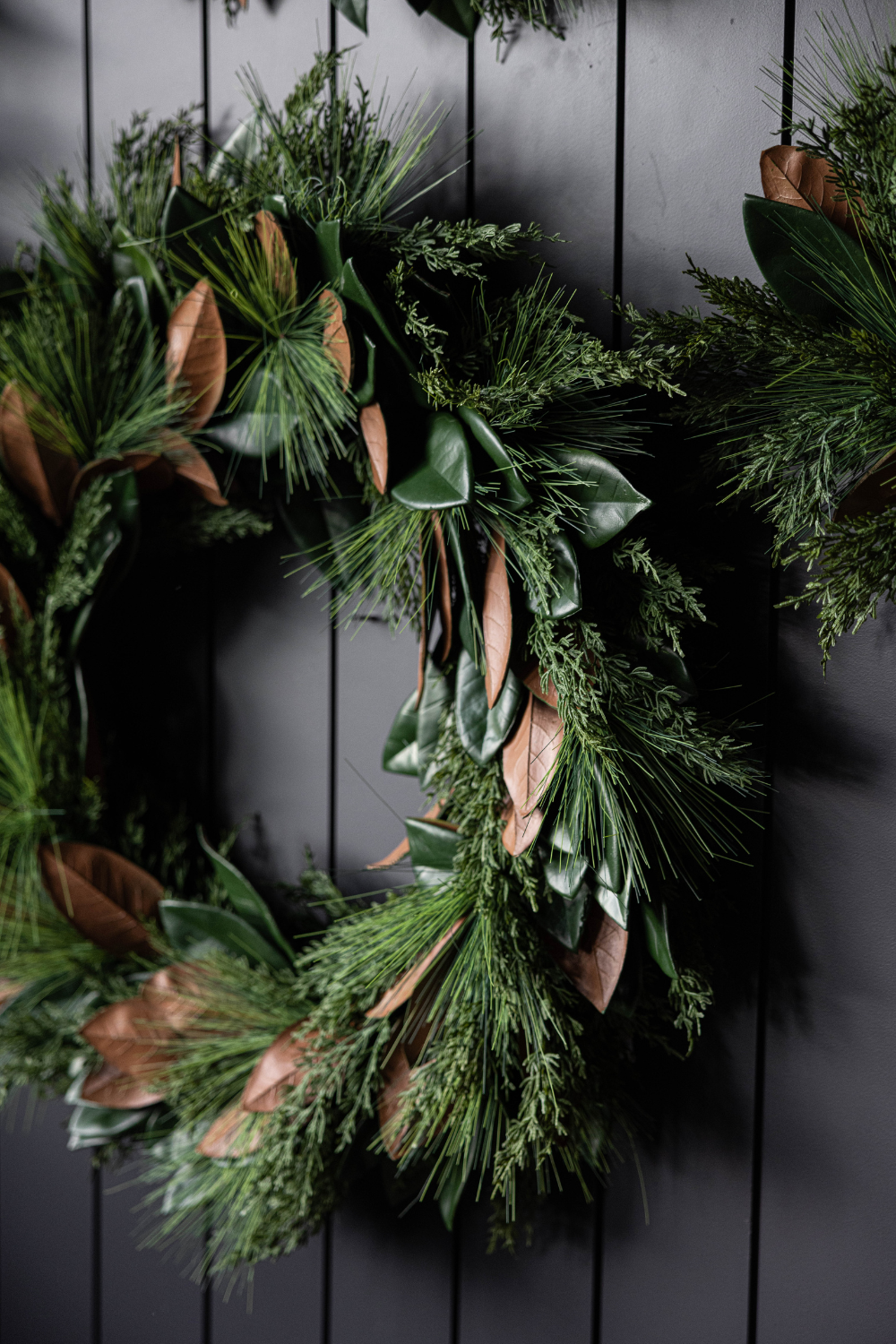 Luxe B Co Magnolia Norfolk Cypress mixed real touch wreath, 34-inch size, with lush greenery and elegant decorative accents.