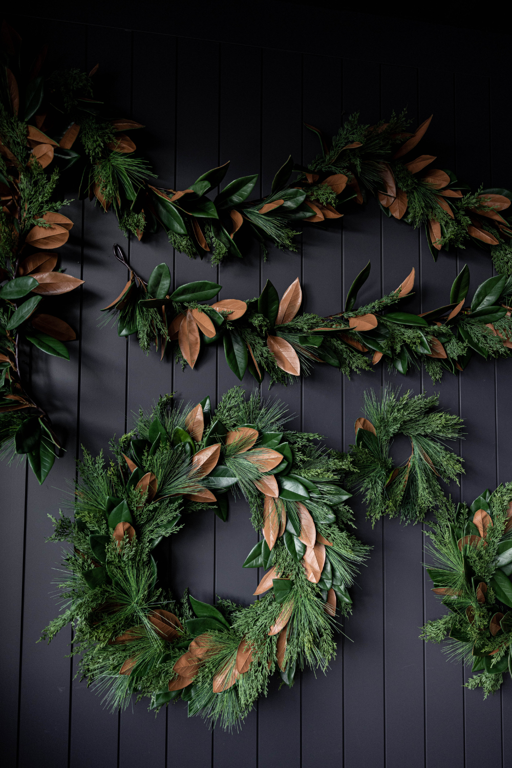 Luxe B Co Magnolia Norfolk Cypress mixed real touch Christmas garland, 15 ft, with lush green foliage and realistic pinecones.