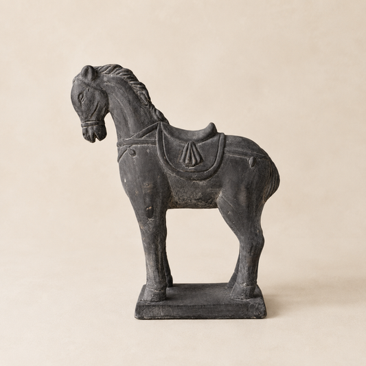 Black cement horse statue, decorative object by Luxe B Co, featuring detailed craftsmanship and a sleek, modern design.