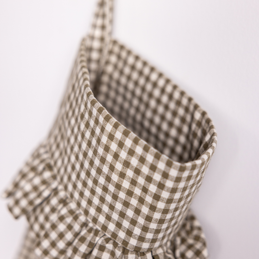 Olive gingham holiday stocking with a bow, Luxe B Co. Christmas stocking for festive decor and gift hanging.