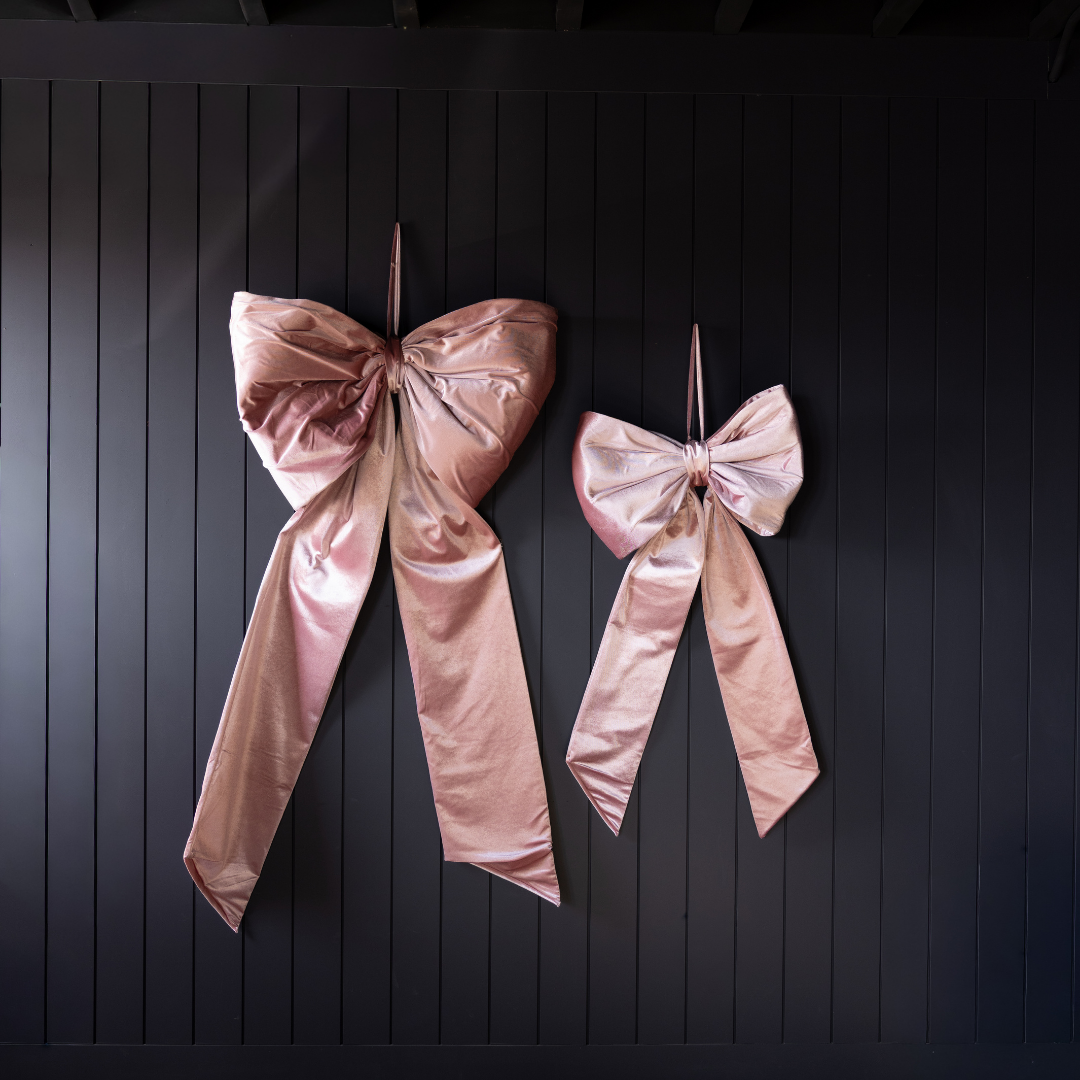 Large pink velvet bow by Luxe B Co, featuring soft fabric and oversized design, perfect for hair accessories or decorative use.