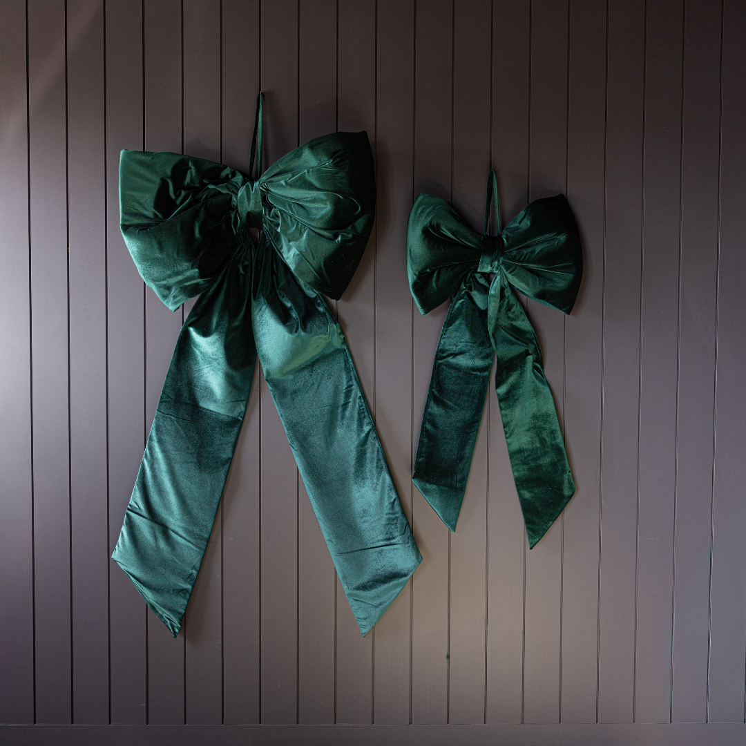 Large emerald green velvet bow from Luxe B Co, featuring an oversized, soft, and luxurious fabric design perfect for accessories.