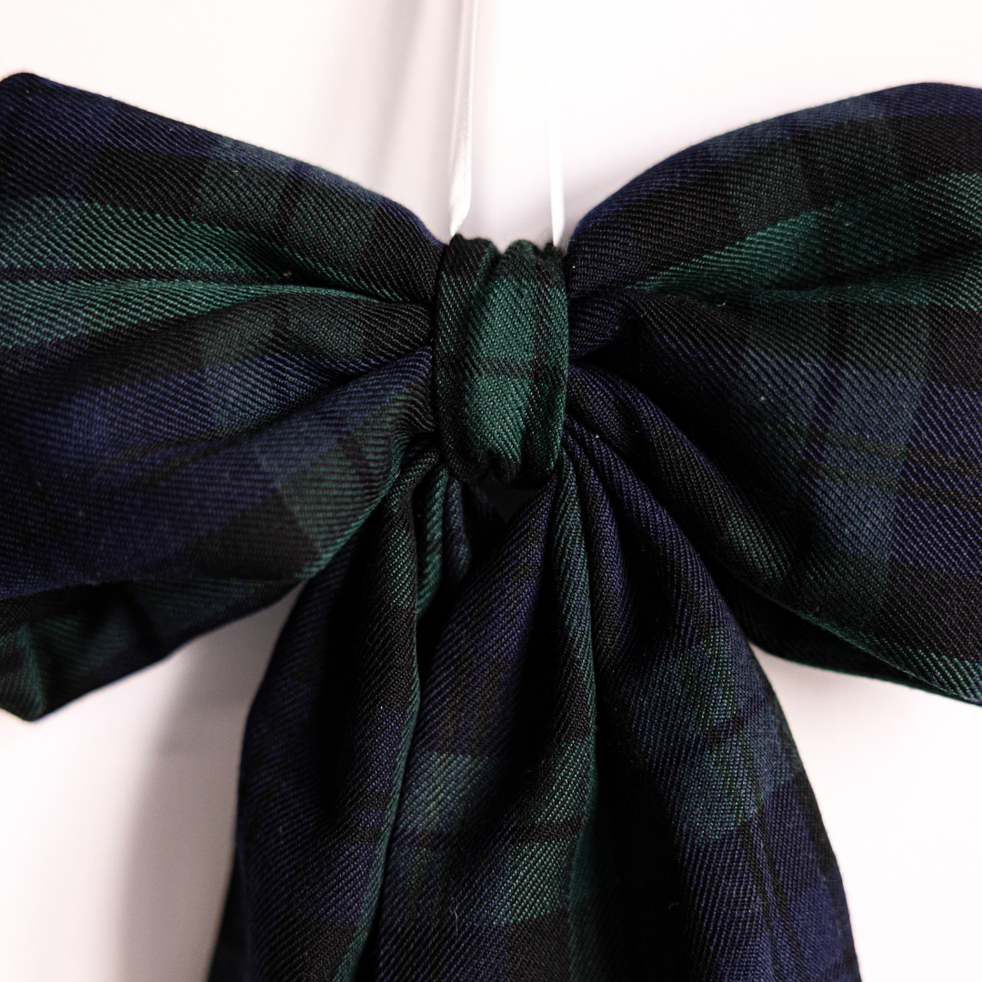 Green plaid fabric bows by Luxe B Co featuring classic pattern and soft texture, perfect for accessories or gift wrapping.