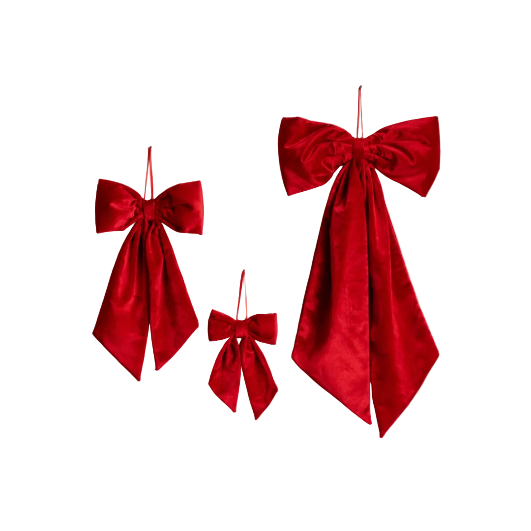 Close-up of Luxe B Co Ralph red velvet fabric bow with detailed stitching and soft texture on a white background.