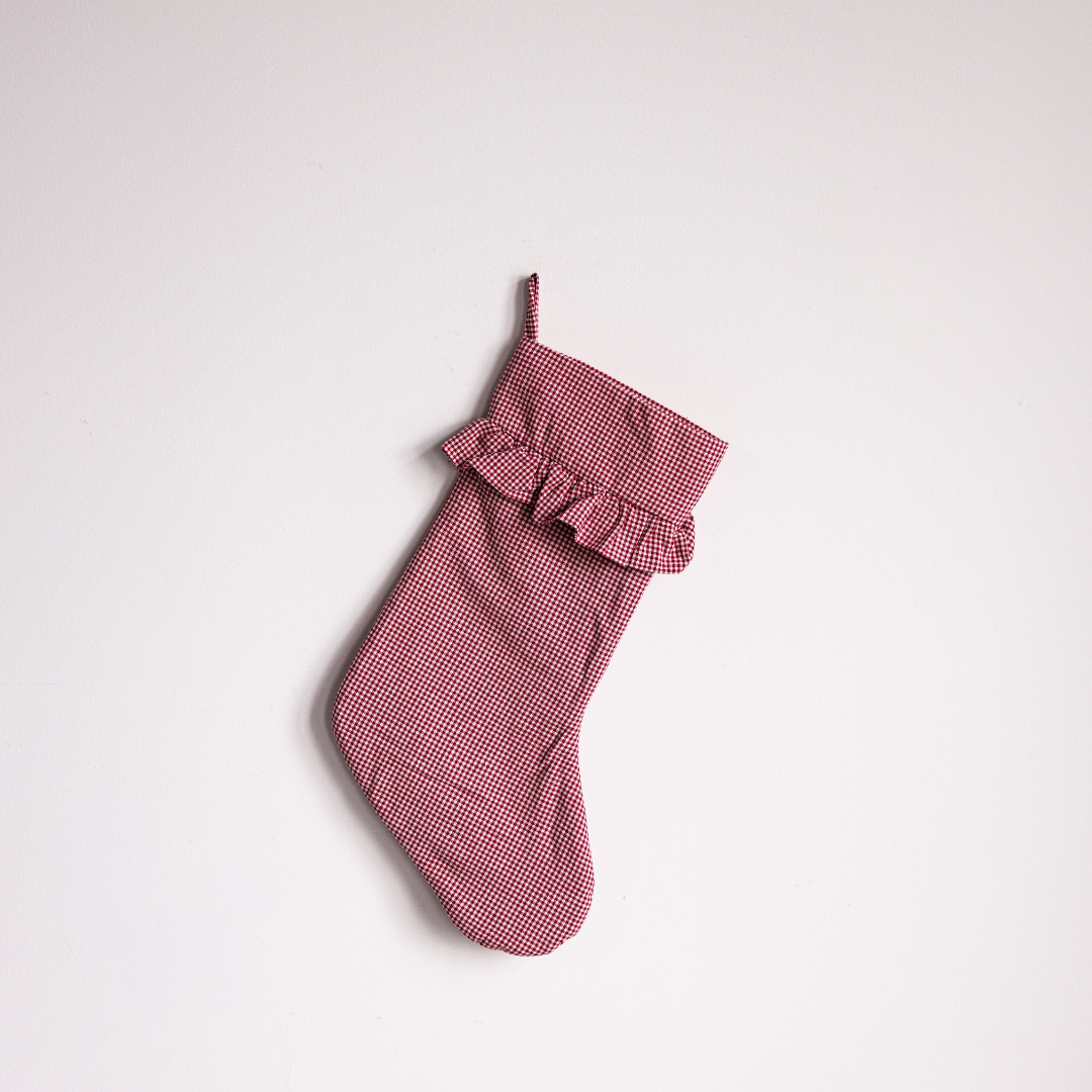 Red mini gingham holiday stocking by Luxe B Co, featuring festive red and white checkered pattern and cozy design.